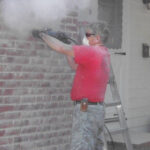 Man working on masonry repairs