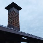 Old brick chimney that is leaning