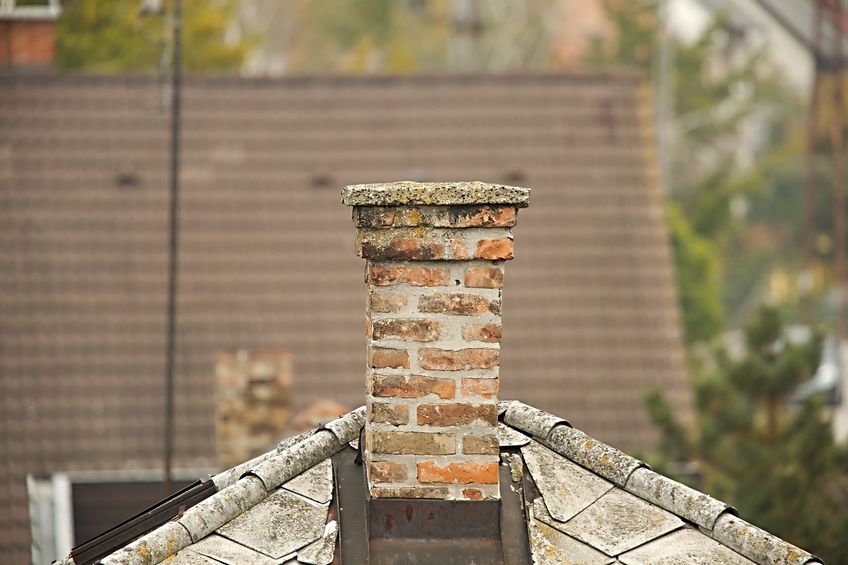 Old chimney in need of crown repairs