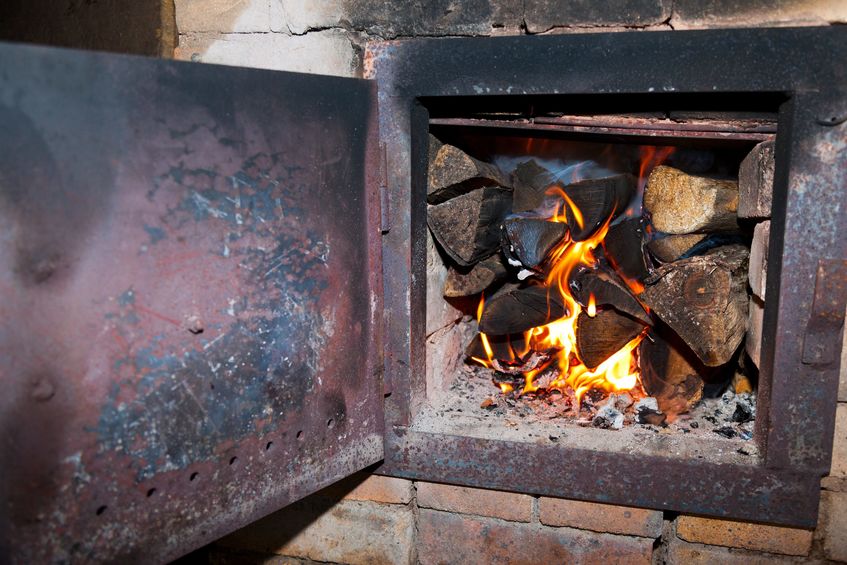 old fireplace with open door