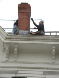 Rooftop chimney workers