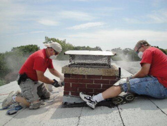 Workers installing Chimney Top