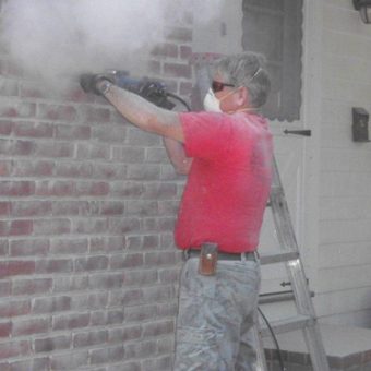 Man working on masonry repairs